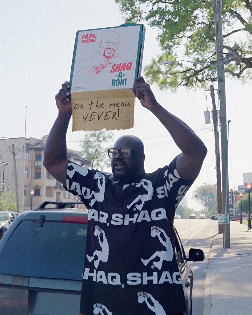 Shaquille O'Neal holding a Shaq-a-Roni box