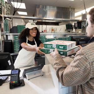 Customer picking up order from Papa Johns