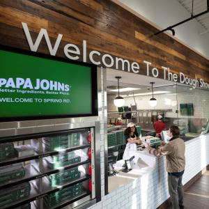 Customer picking up order from Papa Johns