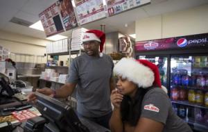 Jarvis and Josslyn Young working in their Papa Johns restaurant