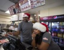 Jarvis and Josslyn Young working in their Papa Johns restaurant